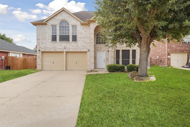 view of front property with a garage and a front lawn