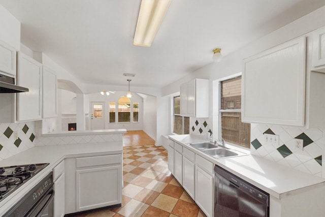 kitchen featuring sink, hanging light fixtures, kitchen peninsula, black dishwasher, and white cabinets