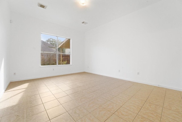 empty room with light tile patterned flooring