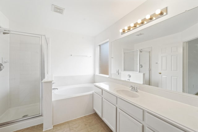 bathroom with vanity, independent shower and bath, and tile patterned flooring