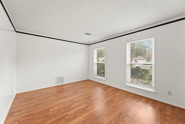 unfurnished room featuring light hardwood / wood-style floors