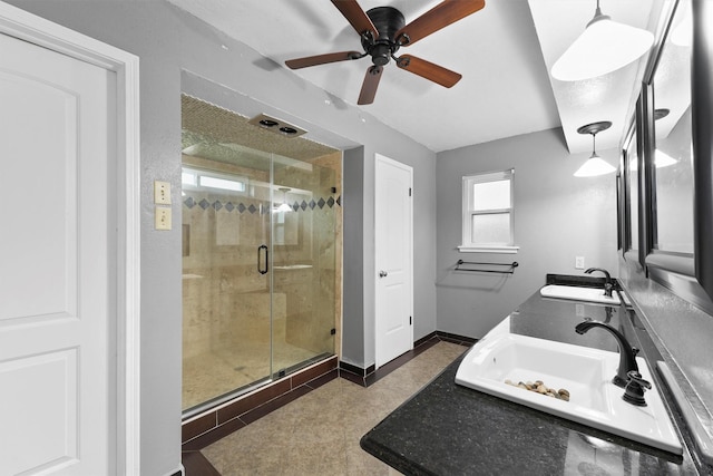 bathroom with ceiling fan, a healthy amount of sunlight, a shower with shower door, and vanity