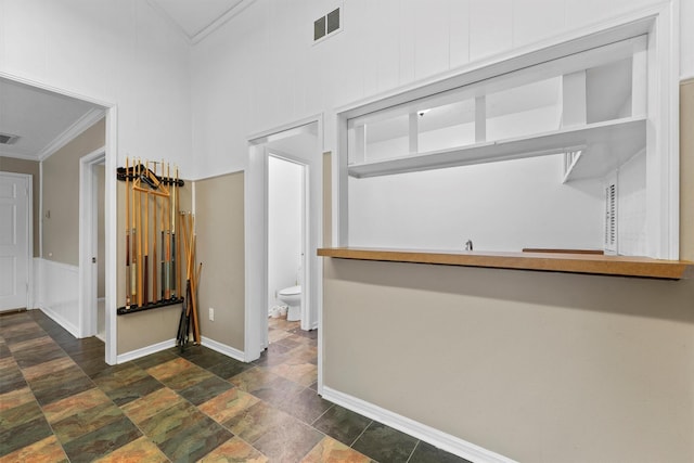 interior space with crown molding