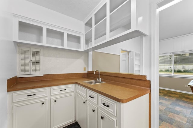 kitchen with sink and white cabinets