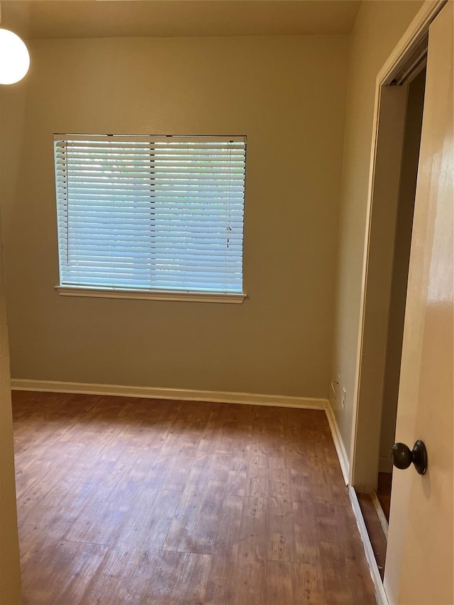 3500 Tangle Brush Dr Unit 195, The Woodlands, TX 77381 - unfurnished room featuring plenty of natural light and dark hardwood / wood-style flooring