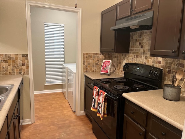 3500 Tangle Brush Dr Unit 195, The Woodlands, TX 77381 - kitchen featuring dark brown cabinetry, black range with electric cooktop, decorative backsplash, and light hardwood / wood-style floors