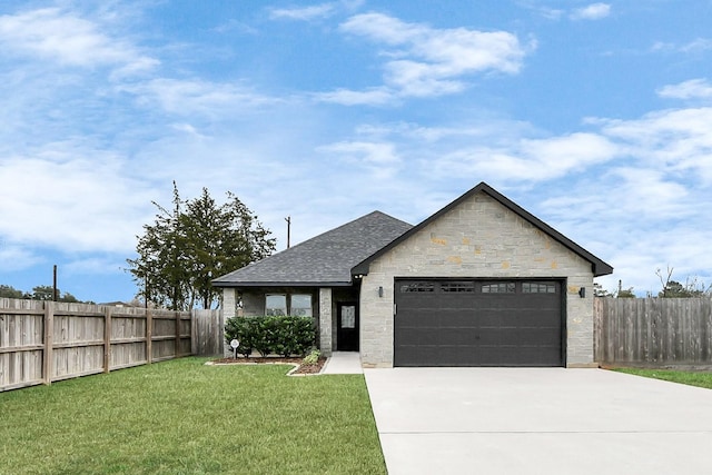 view of front of house with a garage and a front yard