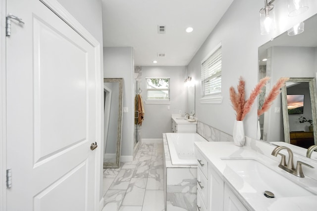 bathroom featuring vanity and shower with separate bathtub