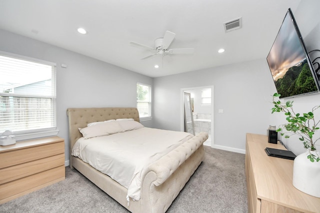 carpeted bedroom featuring ceiling fan and ensuite bathroom