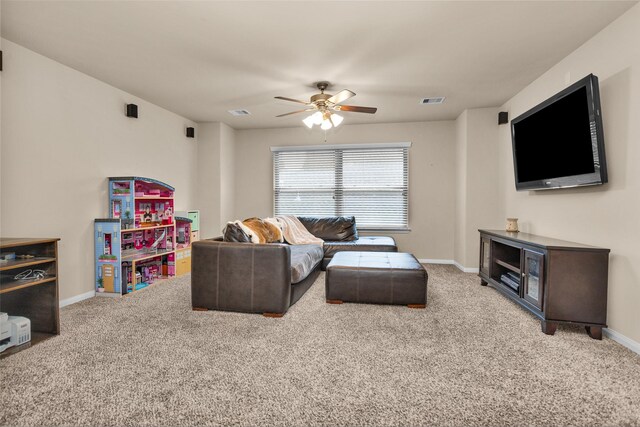 living room with ceiling fan and carpet flooring