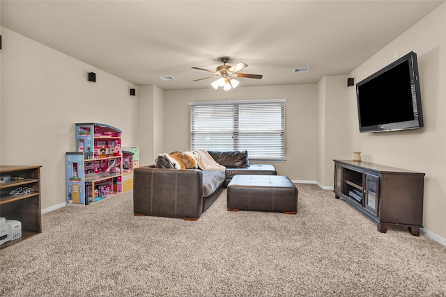 carpeted living room with ceiling fan