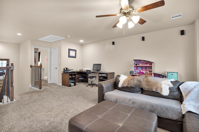 living room with ceiling fan and carpet floors