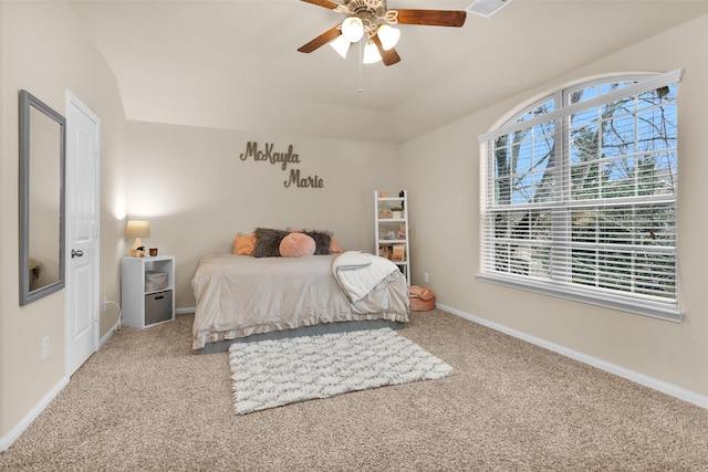 carpeted bedroom with ceiling fan and lofted ceiling