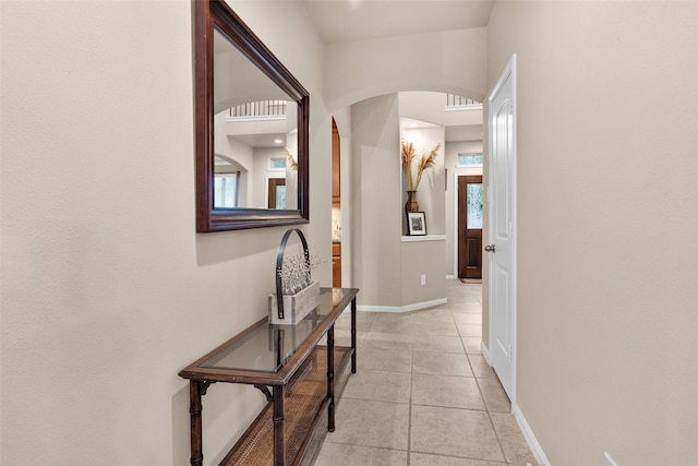 corridor with light tile patterned floors