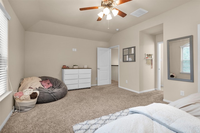 carpeted bedroom with vaulted ceiling and ceiling fan