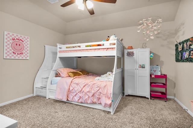 carpeted bedroom with vaulted ceiling and ceiling fan