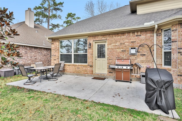 view of patio featuring a grill