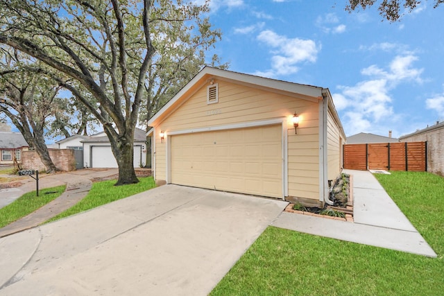 garage featuring a lawn