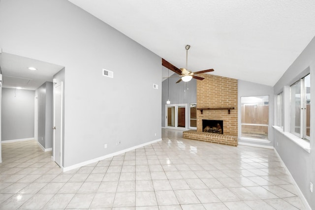 unfurnished living room with light tile patterned flooring, ceiling fan, high vaulted ceiling, and a brick fireplace