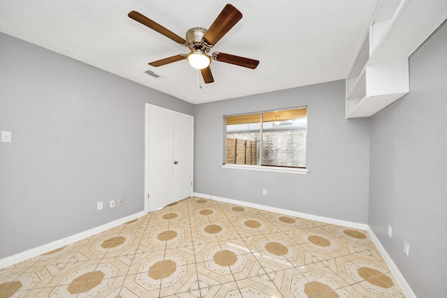 unfurnished room featuring ceiling fan