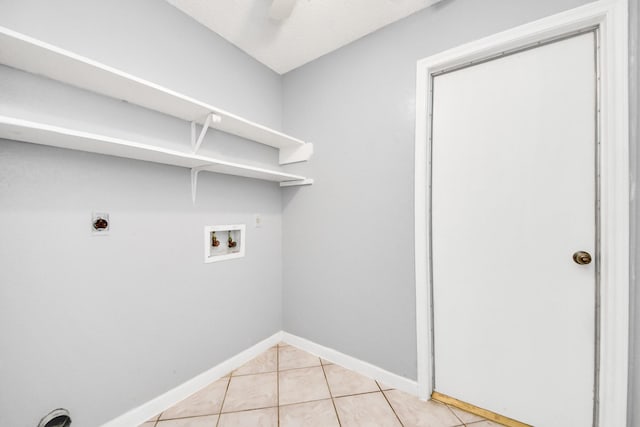 laundry room featuring hookup for a washing machine, electric dryer hookup, light tile patterned floors, and ceiling fan