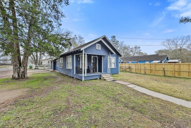 back of house with a yard