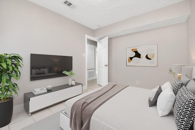 tiled bedroom with a textured ceiling