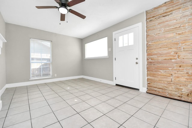 tiled foyer entrance featuring ceiling fan