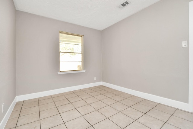 empty room with a textured ceiling