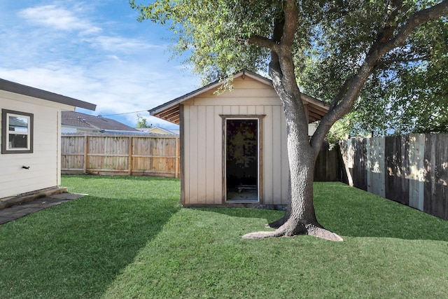 view of outbuilding featuring a yard