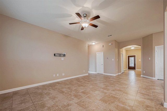 spare room featuring ceiling fan and light tile patterned floors