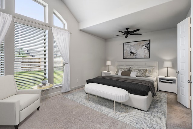 bedroom featuring ceiling fan, light colored carpet, and vaulted ceiling