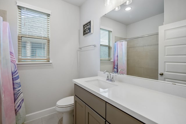 bathroom with vanity, tile patterned floors, and toilet