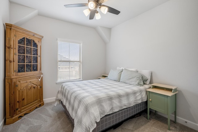 carpeted bedroom featuring lofted ceiling and ceiling fan