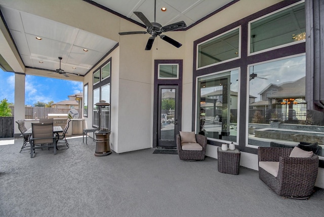 view of patio featuring ceiling fan