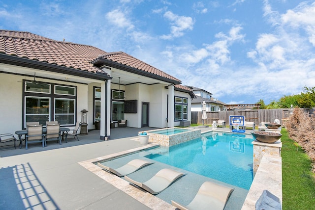 view of swimming pool featuring a patio, ceiling fan, and an in ground hot tub