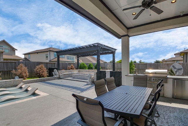 view of patio with grilling area, ceiling fan, and exterior kitchen