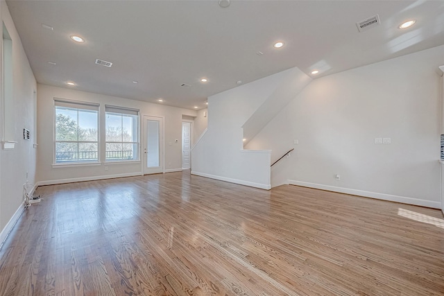 spare room with light hardwood / wood-style flooring