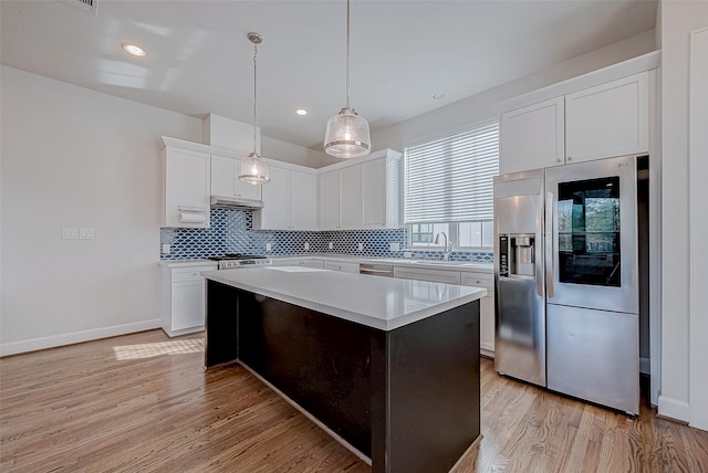 kitchen featuring white cabinetry, a center island, pendant lighting, and stainless steel fridge with ice dispenser