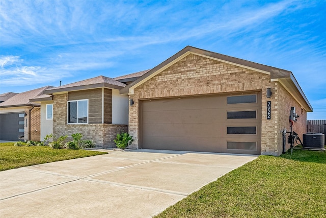 view of front of home featuring a front lawn and central air condition unit