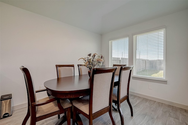 dining area with light hardwood / wood-style floors