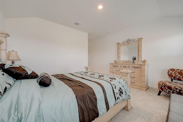 carpeted bedroom with vaulted ceiling