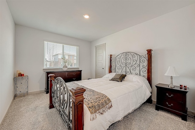 bedroom featuring light colored carpet