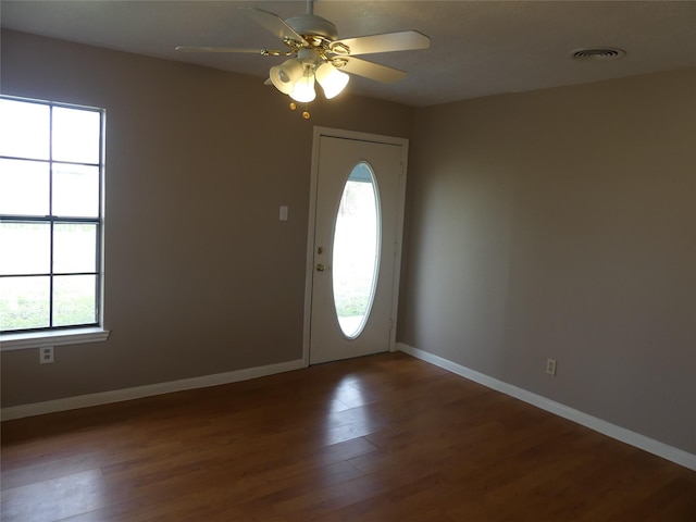 foyer entrance featuring ceiling fan and dark hardwood / wood-style flooring