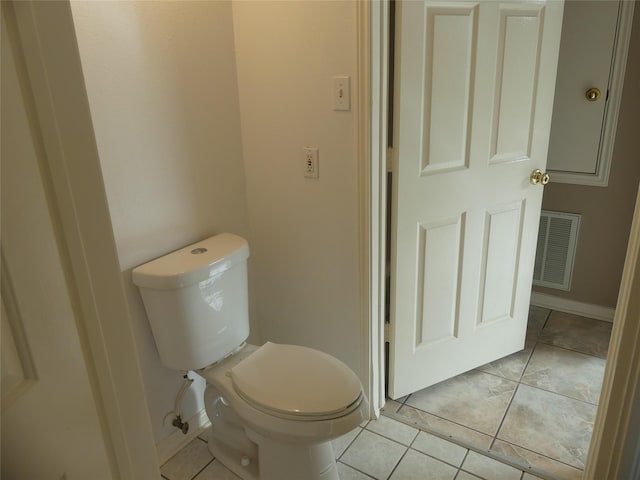 bathroom with tile patterned floors and toilet