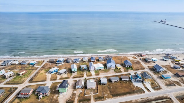 aerial view featuring a water view and a beach view