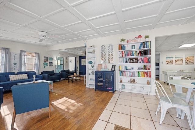 tiled living room with ceiling fan