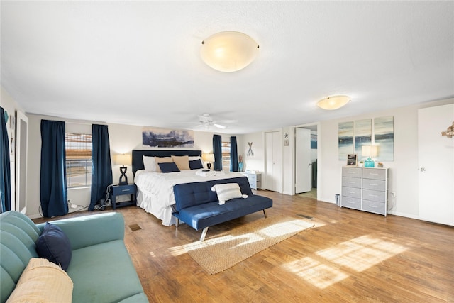 bedroom featuring hardwood / wood-style floors and ceiling fan