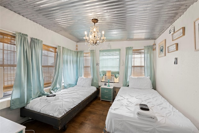 bedroom with dark wood-type flooring, cooling unit, wooden ceiling, and an inviting chandelier