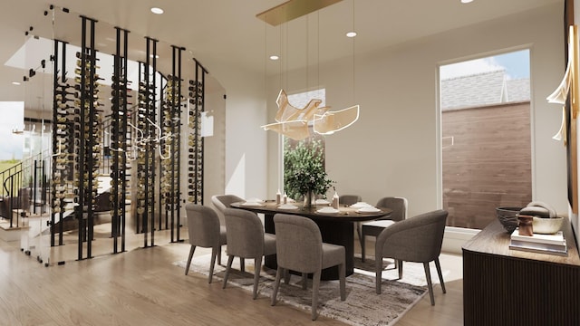 dining space with hardwood / wood-style floors